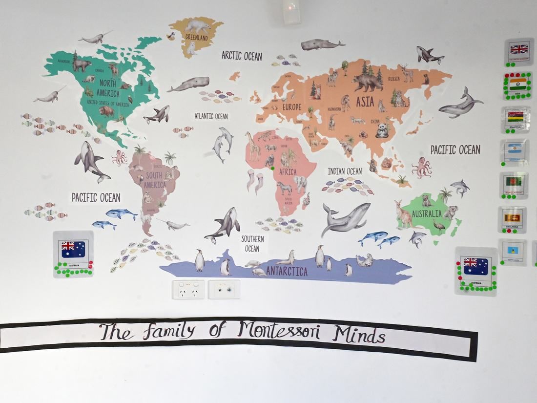The family wall at Montessori Minds: a world map surrounded by the flags of the centre's families
