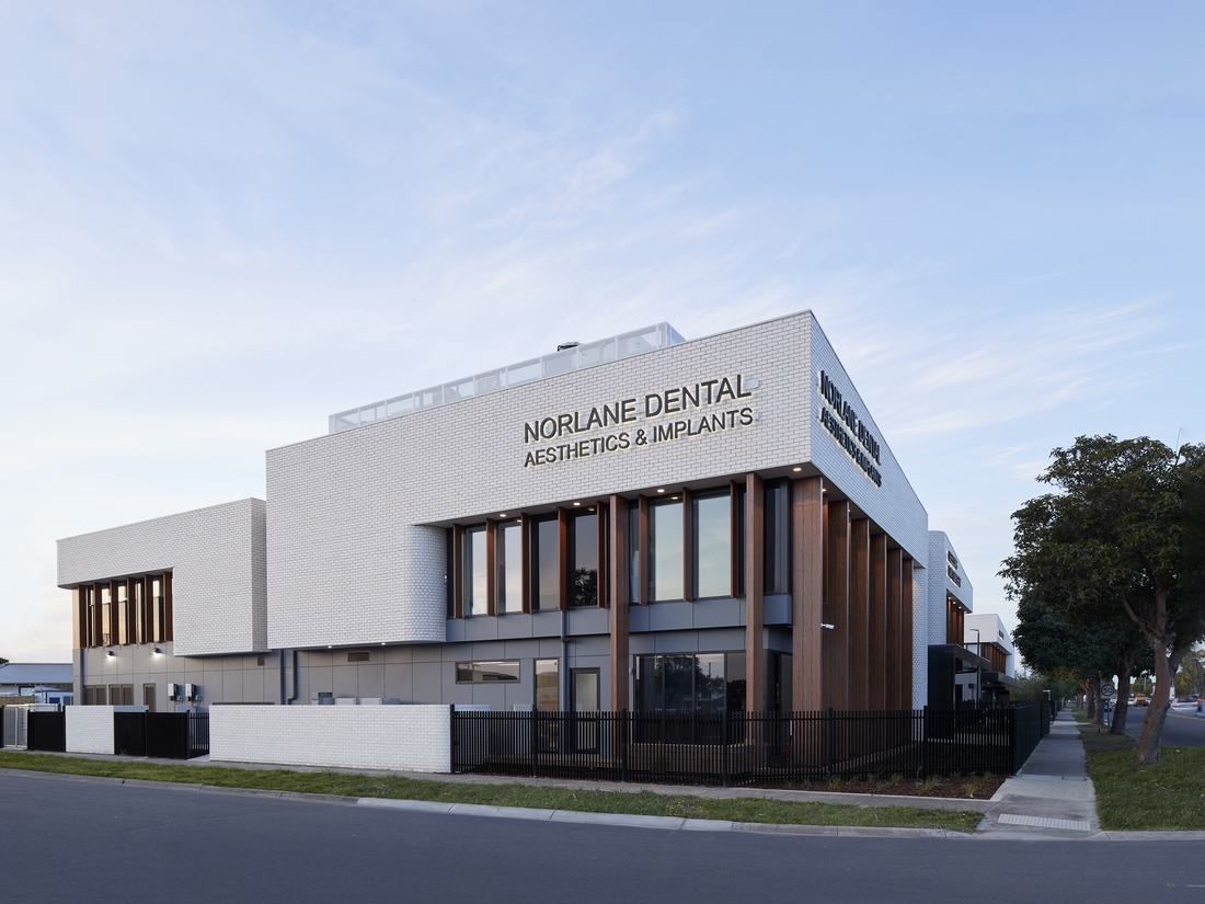 Norlane Dental Aesthetics & Implants at the Geelong Healthcare Precinct at dusk, Princes Highway, Norlane